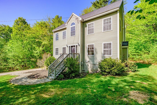 9 Eisenhower Ct, Naples, ME 04055 - colonial house featuring a front lawn
