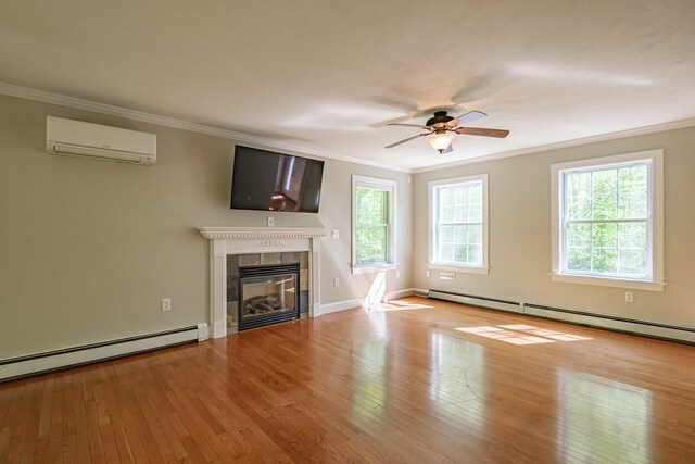 9 Eisenhower Ct, Naples, ME 04055 - unfurnished living room with a wall mounted AC, ornamental molding, a baseboard heating unit, hardwood / wood-style flooring, and a ceiling fan