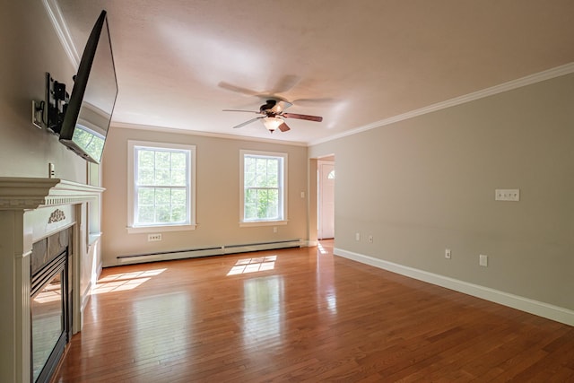 9 Eisenhower Ct, Naples, ME 04055 - unfurnished living room featuring baseboard heating, crown molding, a ceiling fan, hardwood / wood-style floors, and a premium fireplace