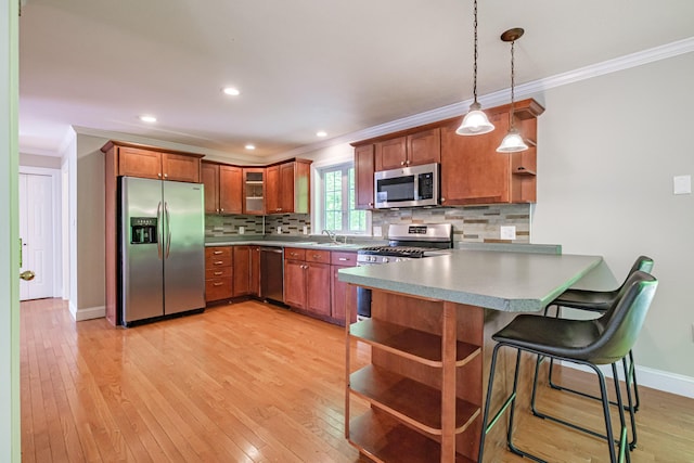 9 Eisenhower Ct, Naples, ME 04055 - kitchen with stainless steel appliances, ornamental molding, a peninsula, open shelves, and baseboards