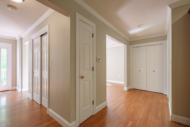 9 Eisenhower Ct, Naples, ME 04055 - hallway with light wood finished floors, ornamental molding, and baseboards