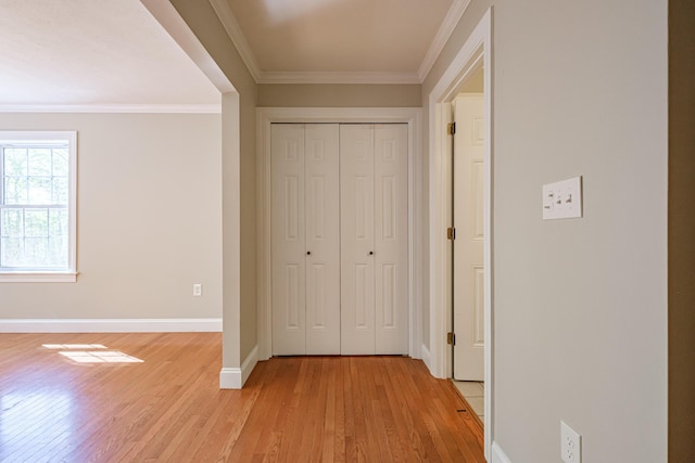 9 Eisenhower Ct, Naples, ME 04055 - hallway featuring light wood finished floors, crown molding, and baseboards