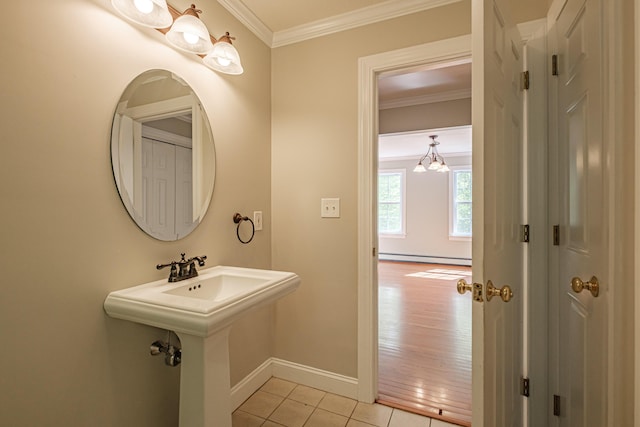 9 Eisenhower Ct, Naples, ME 04055 - bathroom featuring baseboards, crown molding, tile patterned floors, baseboard heating, and a chandelier