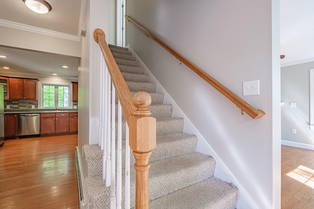 9 Eisenhower Ct, Naples, ME 04055 - stairs with ornamental molding and wood finished floors
