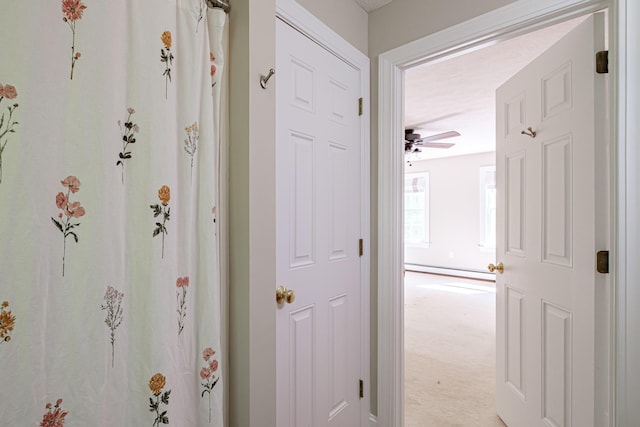 9 Eisenhower Ct, Naples, ME 04055 - hall with baseboard heating and light colored carpet