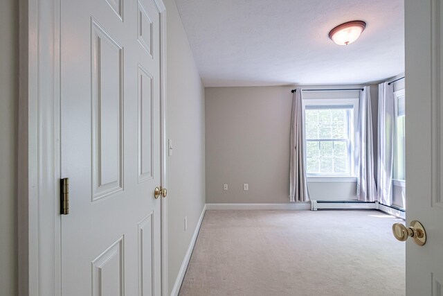 9 Eisenhower Ct, Naples, ME 04055 - carpeted spare room with baseboard heating and baseboards