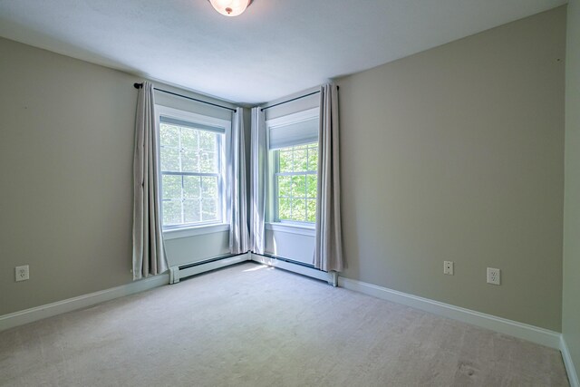 9 Eisenhower Ct, Naples, ME 04055 - carpeted empty room featuring a baseboard heating unit and baseboards