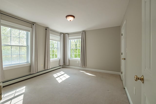 9 Eisenhower Ct, Naples, ME 04055 - unfurnished room featuring baseboard heating, light carpet, and baseboards