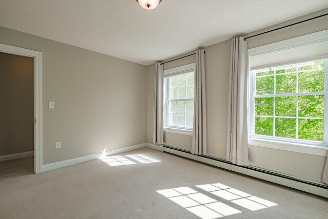 9 Eisenhower Ct, Naples, ME 04055 - spare room with a baseboard heating unit, carpet floors, and baseboards