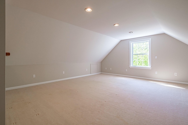 9 Eisenhower Ct, Naples, ME 04055 - additional living space featuring light carpet, lofted ceiling, baseboards, and recessed lighting