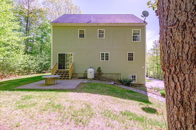 9 Eisenhower Ct, Naples, ME 04055 - back of house with a lawn and a patio area