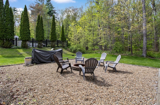 view of yard with an outdoor fire pit
