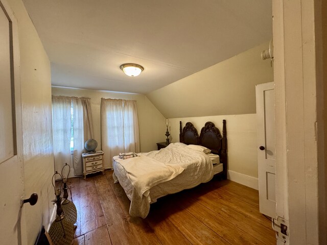 4 Main St, Saint Albans, ME 04971 - bedroom with hardwood / wood-style floors, lofted ceiling, and baseboards