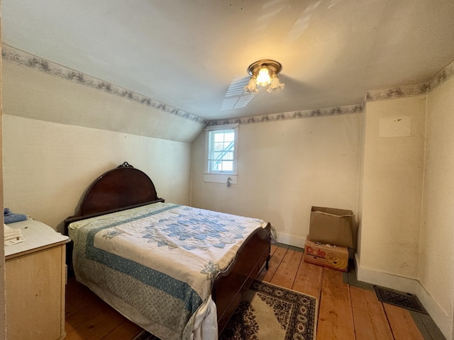 4 Main St, Saint Albans, ME 04971 - bedroom with hardwood / wood-style flooring, lofted ceiling, and baseboards