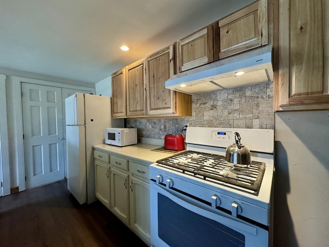 4 Main St, Saint Albans, ME 04971 - kitchen featuring white appliances, under cabinet range hood, light countertops, tasteful backsplash, and dark wood finished floors