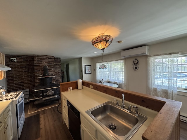 4 Main St, Saint Albans, ME 04971 - kitchen featuring a wood stove, a sink, dishwasher, white range with gas stovetop, and a wall mounted AC