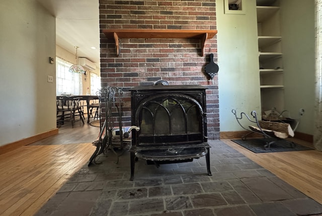 4 Main St, Saint Albans, ME 04971 - detailed view of a wall unit AC, wood finished floors, and baseboards
