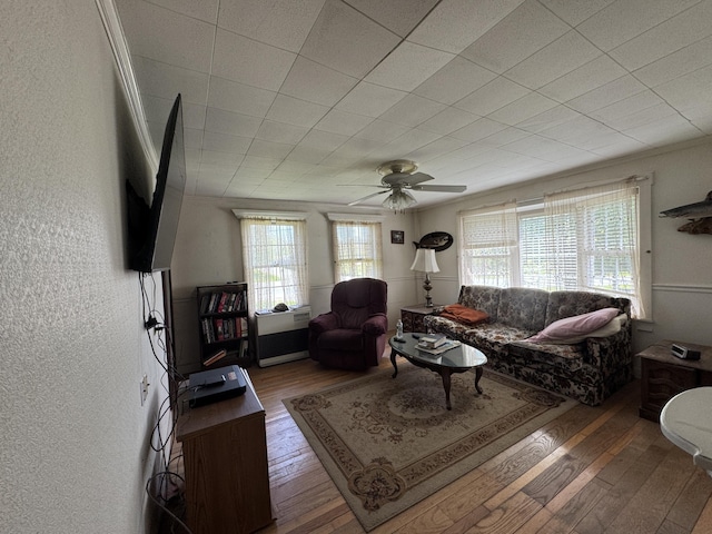 4 Main St, Saint Albans, ME 04971 - living room with hardwood / wood-style flooring, ceiling fan, and a textured wall