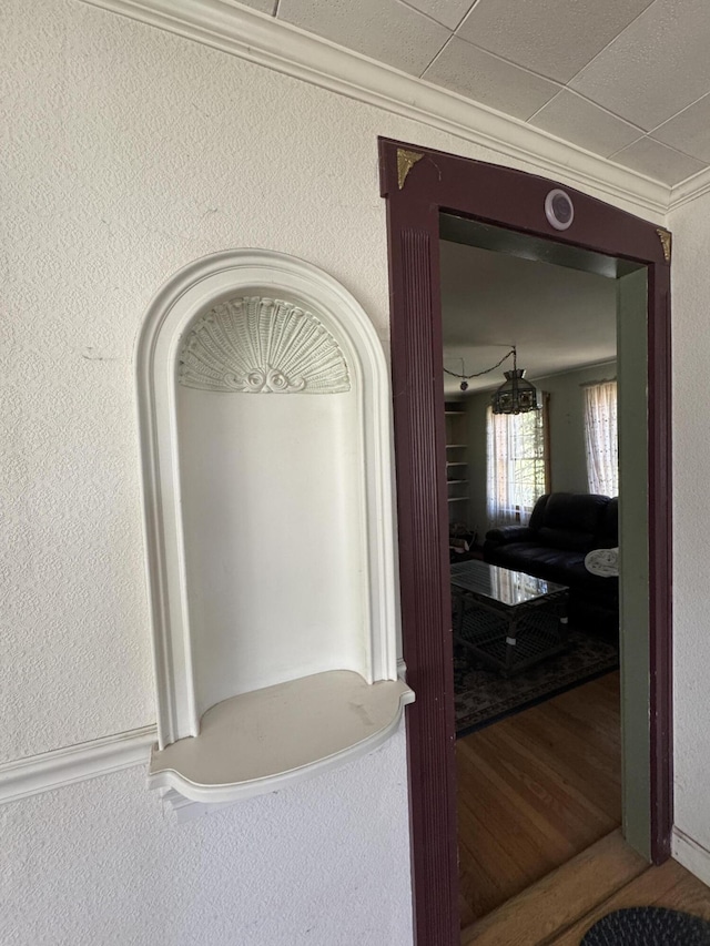 4 Main St, Saint Albans, ME 04971 - corridor with ornamental molding, a textured wall, and wood finished floors