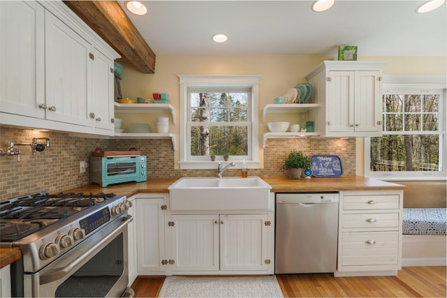 603 S Freedom Rd, Albion, ME 04910 - kitchen featuring dishwasher, stainless steel range with gas stovetop, open shelves, a sink, and light wood-style flooring