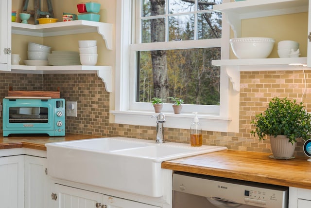 603 S Freedom Rd, Albion, ME 04910 - kitchen featuring open shelves, dishwasher, wooden counters, and decorative backsplash