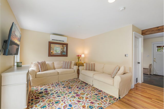 603 S Freedom Rd, Albion, ME 04910 - living area featuring an AC wall unit and light wood-type flooring