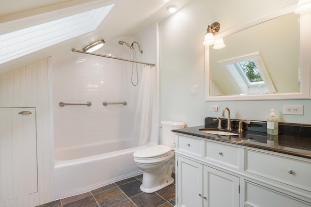 603 S Freedom Rd, Albion, ME 04910 - full bath featuring a skylight, toilet, vanity, shower / bathtub combination with curtain, and stone finish floors