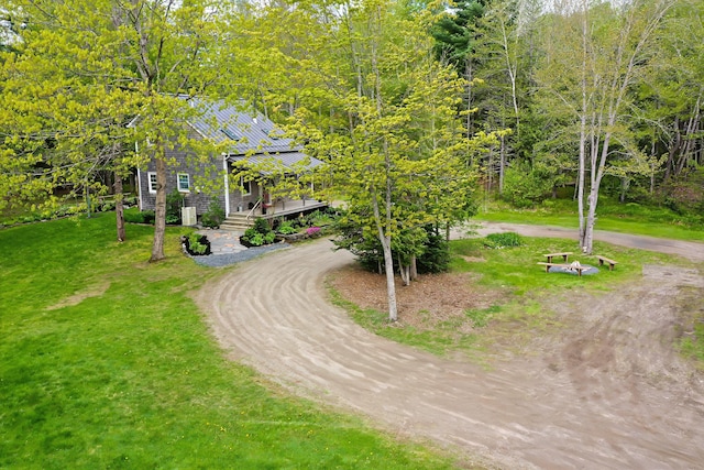 603 S Freedom Rd, Albion, ME 04910 - view of home's community featuring curved driveway, a yard, and a forest view