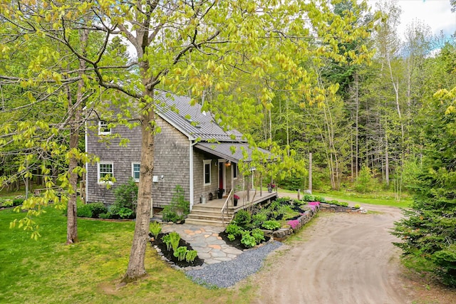 603 S Freedom Rd, Albion, ME 04910 - view of front of property with metal roof, a standing seam roof, a front lawn, and dirt driveway