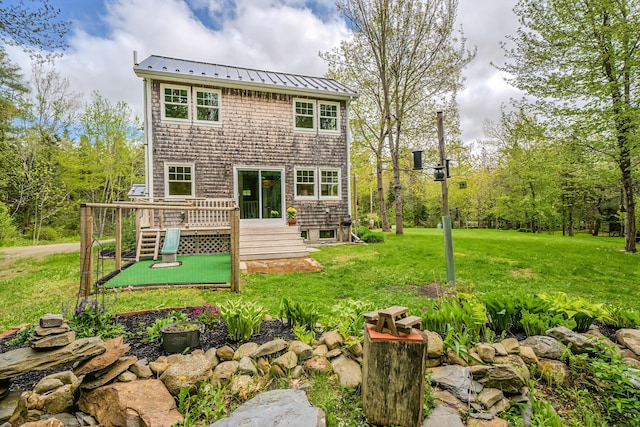 603 S Freedom Rd, Albion, ME 04910 - back of house featuring a lawn, a standing seam roof, a deck, and metal roof
