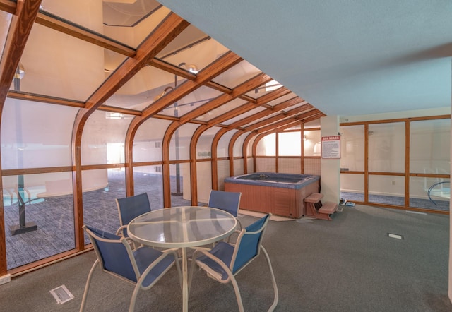 215 E Grand Ave Unit 210, Old Orchard Beach, ME 04064 - unfurnished sunroom with a jacuzzi and outdoor dining space
