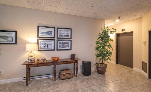 215 E Grand Ave Unit 210, Old Orchard Beach, ME 04064 - hallway featuring baseboards, a baseboard radiator, and elevator