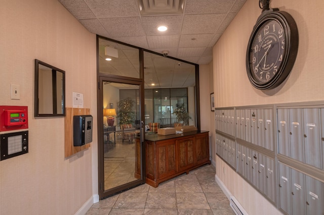215 E Grand Ave Unit 210, Old Orchard Beach, ME 04064 - hall with mail area, a drop ceiling, and baseboards