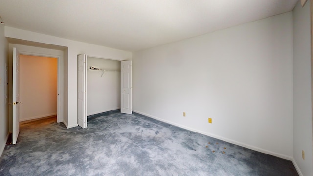 215 E Grand Ave Unit 210, Old Orchard Beach, ME 04064 - unfurnished bedroom with carpet flooring, baseboards, and a closet