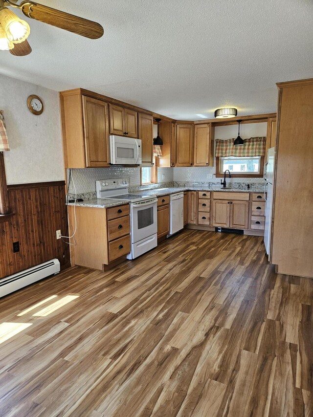 1377 Pushaw Rd, Glenburn, ME 04401 - kitchen with white appliances, a textured ceiling, dark wood-style floors, a sink, and brown cabinets
