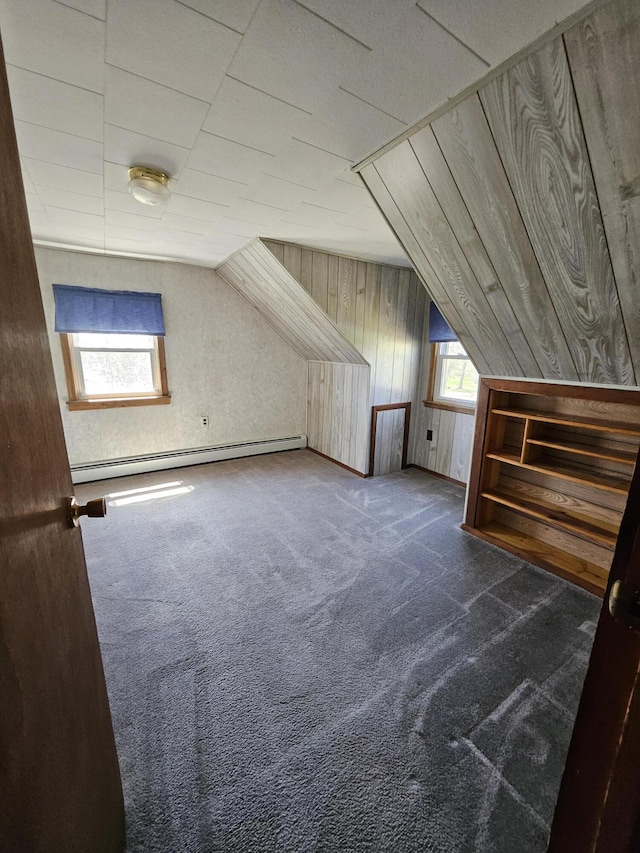 1377 Pushaw Rd, Glenburn, ME 04401 - additional living space featuring baseboard heating, carpet flooring, wooden walls, and lofted ceiling