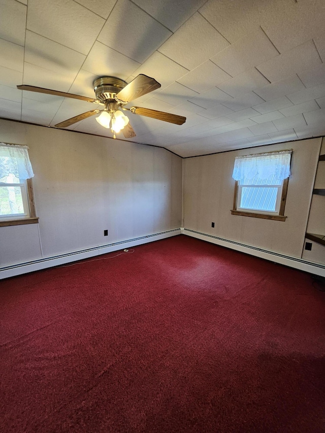 1377 Pushaw Rd, Glenburn, ME 04401 - spare room featuring plenty of natural light, dark carpet, and a ceiling fan