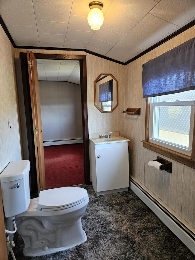1377 Pushaw Rd, Glenburn, ME 04401 - bathroom featuring baseboard heating, ornamental molding, toilet, and vanity