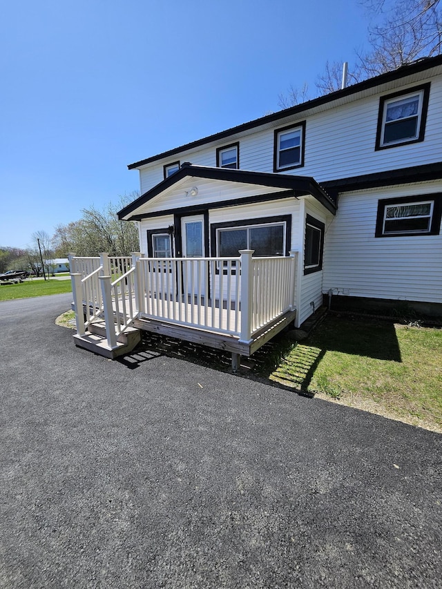 1377 Pushaw Rd, Glenburn, ME 04401 - view of front of house with a deck
