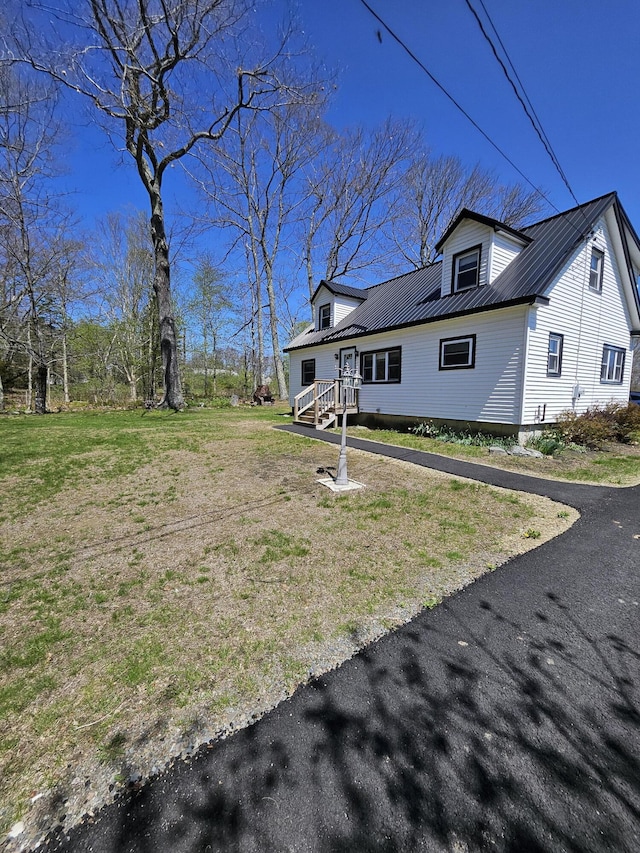 1377 Pushaw Rd, Glenburn, ME 04401 - rear view of house featuring metal roof and a yard