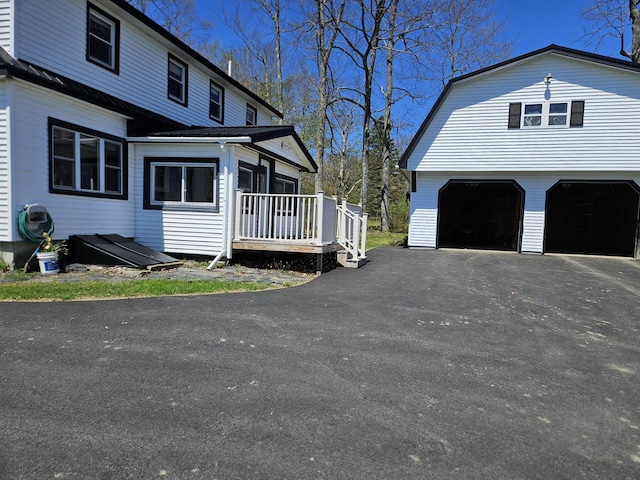 1377 Pushaw Rd, Glenburn, ME 04401 - view of side of property featuring a garage and a gambrel roof