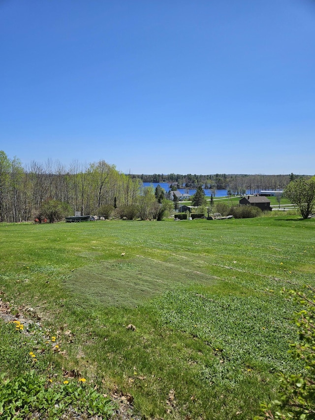 1377 Pushaw Rd, Glenburn, ME 04401 - view of green lawn featuring a water view