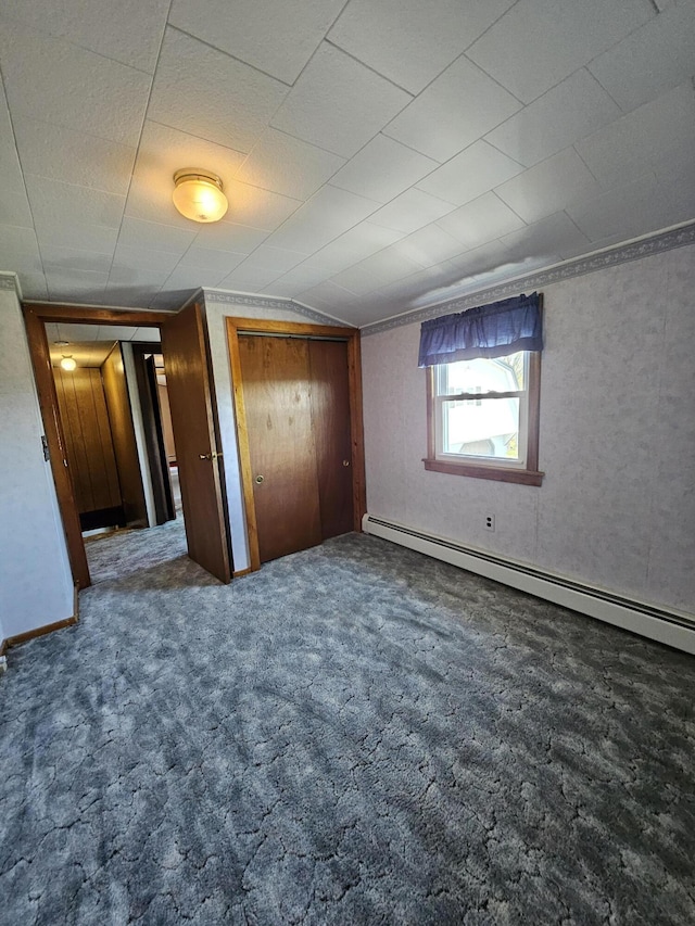 1377 Pushaw Rd, Glenburn, ME 04401 - unfurnished bedroom with a baseboard heating unit, carpet flooring, and lofted ceiling