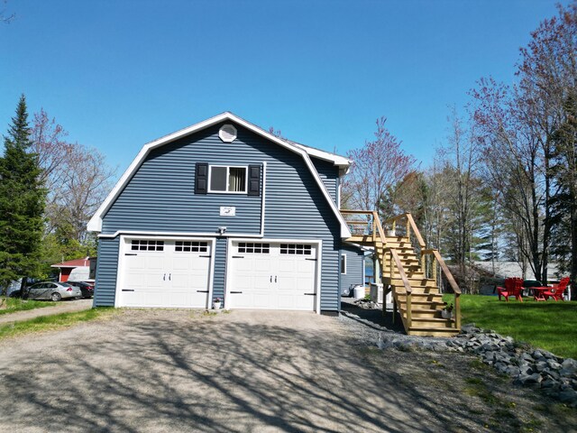 11 Beethoven Ln, Enfield, ME 04493 - view of side of home with a gambrel roof and stairs