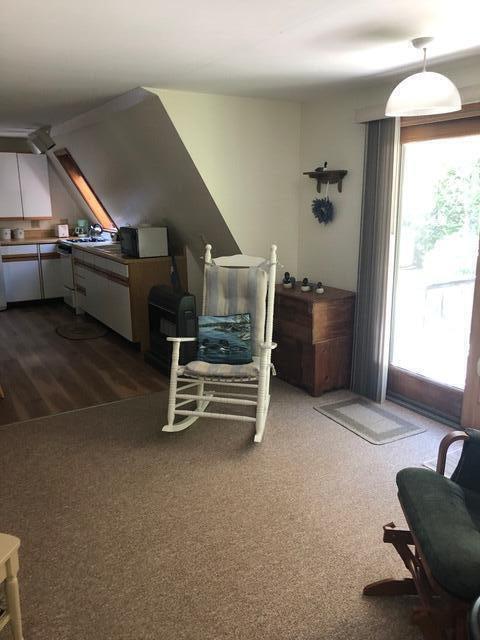 11 Beethoven Ln, Enfield, ME 04493 - bedroom with access to outside and dark carpet