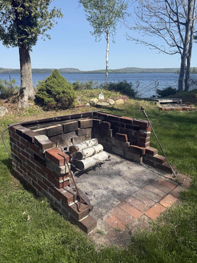 11 Beethoven Ln, Enfield, ME 04493 - view of patio featuring a water view