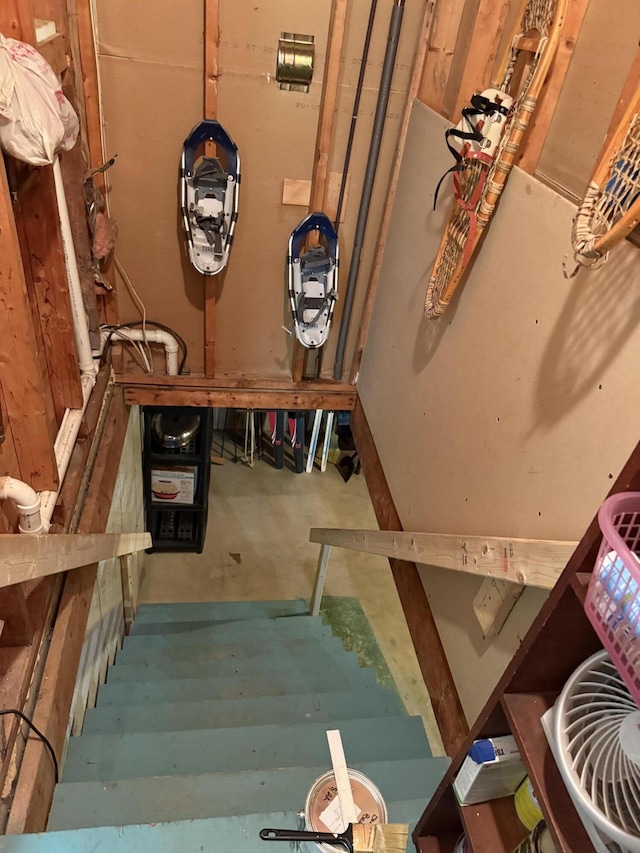 11 Beethoven Ln, Enfield, ME 04493 - stairs featuring unfinished concrete flooring