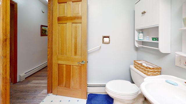 11 Beethoven Ln, Enfield, ME 04493 - bathroom with a baseboard radiator, a sink, and toilet