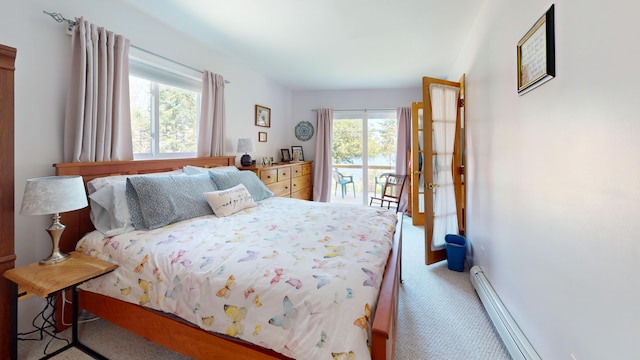 11 Beethoven Ln, Enfield, ME 04493 - bedroom featuring carpet, access to exterior, and a baseboard heating unit