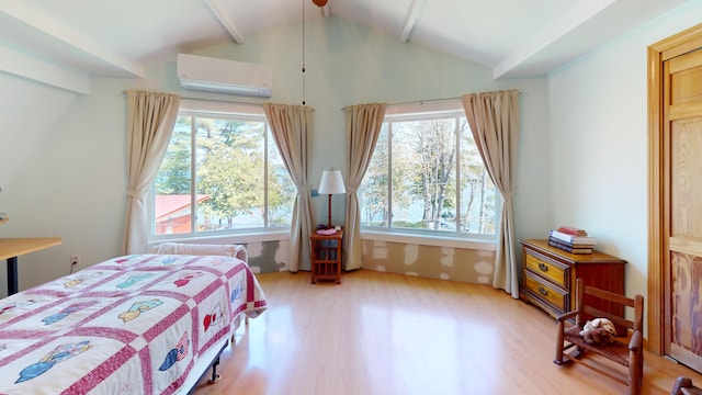 11 Beethoven Ln, Enfield, ME 04493 - bedroom featuring a wall mounted AC, light wood finished floors, and multiple windows